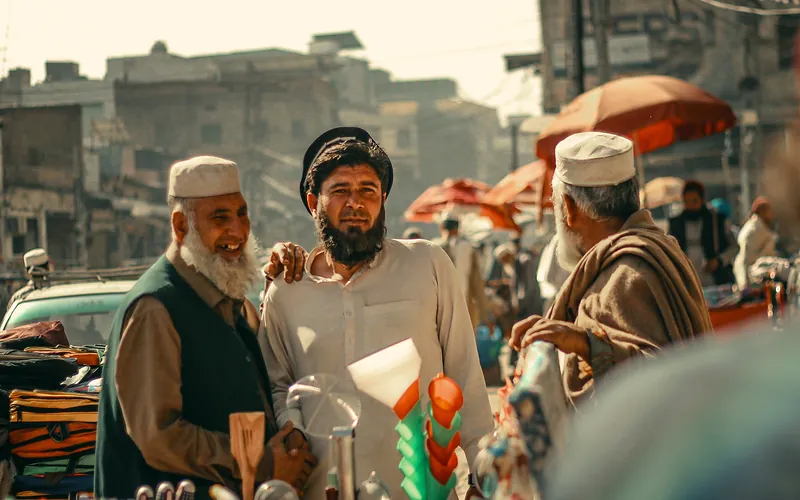 A bustling street market in Peshawar, Pakistan, showing local culture and daily life